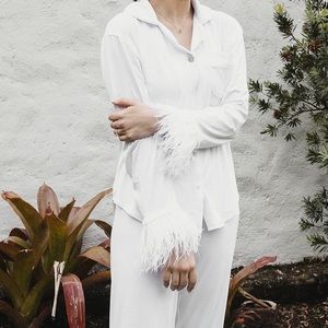 Party pijama set w/feathers. Worn for 15 min, like new. Great Quality.